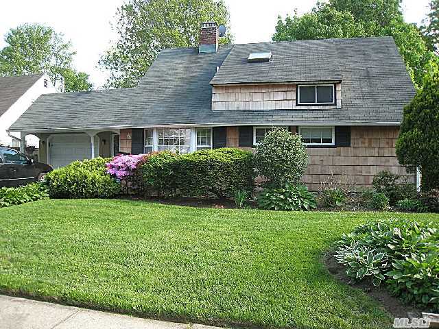 Reduced For Fast Sale! Hurry!  E-X-P-A-N-D-E-D Home!  Addition Across Entire Rear Offers Humongous Living Room With Custom Brick Hearth Plus Den Or 5th Bdrm!  Entry Foyer Leads To  Eat In Kitchen,  Formal Drm. Dormered Upstairs W/ Extra Large Bdrms,  & A Storage Room! Lovely Deck In Rear. Extended Garage. Oversized Lot!  Above Grnd Oil Tank & 200 Amp Elec