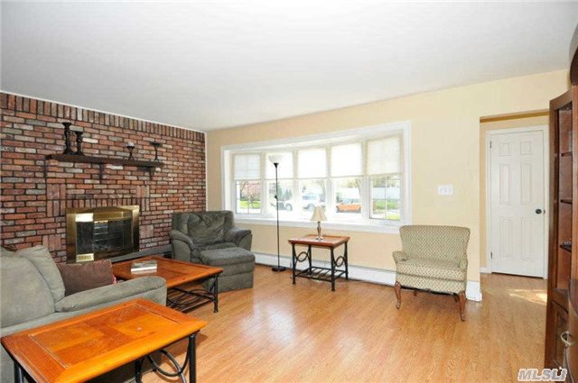 Great Starter-Living Room With Brick Wood Burning Fireplace-Updated Eat In Kitchen-3 Bedrooms-1 Bath Ranch Features Updated Windows-Furnace-Bath-Arch Roof-New Garage Door-Fully Pvc Fenced Property