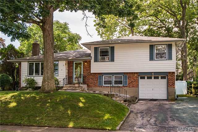 Lovely Split Level In The Heart Of Desirable Oyster Bay. Open Layout Boasts Spacious Lr With Wood Burning Fireplace, 4 Bedrooms, 3 Full Bath, Eik, Family Room Leading To Yard. Beautiful New Finished Basement, New Hw. Perfect Mid Block Location, Close To All.