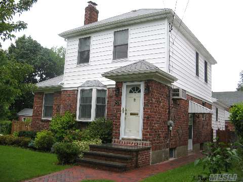 Beautifully Renovated And  Expanded Brick Colonial In Heart Of Port Wash.Entry Foyer Leads To Lr W/Fpl.Office, New Gourmet Kitchen W/Granite Adjoining Dining Area. Family Rm. 3 Bedrooms & 2 New Baths.Hw Floors. Lower Level W/Rec Room,Laundry & Tons Of Storage.Detached Garage.New Windows,Gas Heat.Private Fenced Yard. Short Walk To Town And Rr.Must See!