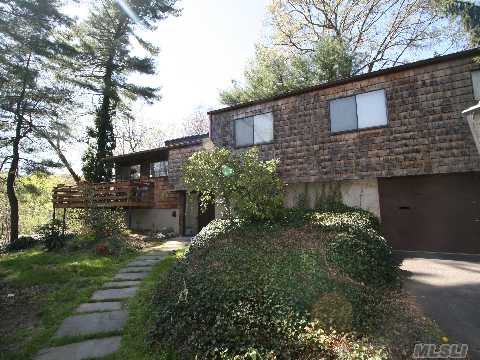 A Gem In A Treetop Retreat.Spacious & Private.Wonderful 4 Br/3 Bath Sunfilled Home.Cathedral Ceiling In Lr W/Brick Walled Fpl,And Large Dr.Oversized Eik.All W/Sliding Doors To Large Deck.Mbr W/New Bath & Reading Nook.Lower Level Playroom/Fam Area Plus Large Basement W/Laundry,Dark Room.Oversized 2 Car Garage. Cac.Tons Of Closets & Storage. Walk To Lirr & Town.