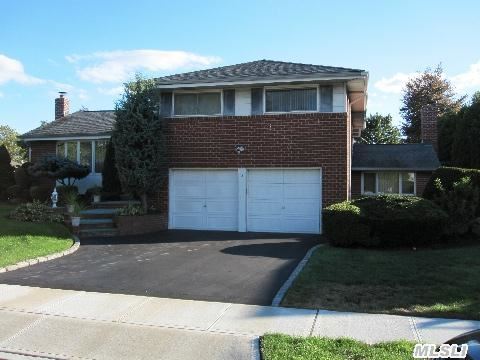 Beautifully Landscaped 4 Level Split Located In Premier Neighborhood. Clean Granite Eat-In Kitchen With Sub Zero Refrigerator And Entrance To Back Yard To Entertain On A Lovely Bluestone Patio With A Gas Connected Bbq. Hardwood Floors Underneath Wall To Wall Carpet. Extended Family Rm Accented By A Fieldstone Wall And Wood-Burning Fireplace. A Clean House, Great Location!!