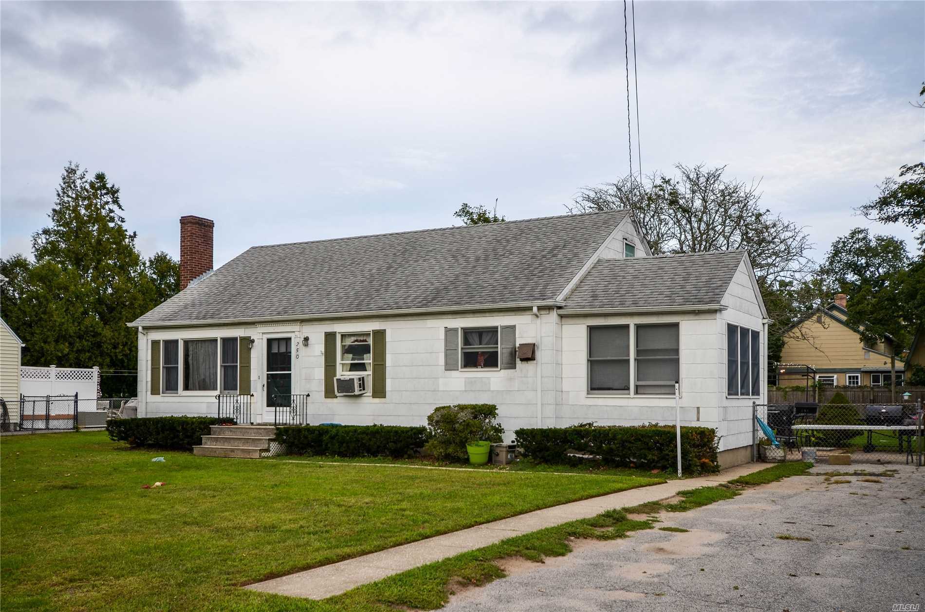 Greenport Village Home On Oversized Lot. Features 3 Bedrooms, 1 Bath, Eik, Enclosed Porch, Oversized Lot, Large, Fenced In Yard. Walk-Up Attic Lends Easily To Possibility Of Finished Second Floor. Awaits Your Imagination, The Possibilities Abound.