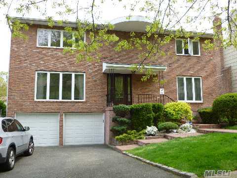 Mint Brick Center Hall Colonial With Skylit 2-Story Entry Foyer, Large Living Room & Formal Dining Room, Den W/Fplce Opening Onto Backyard, Finished Basement, New Roof, New Cac, New Windows, New Garage Doors.