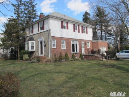 Wonderful Renovated Brick & Stone Colonial On Wonderful Block Minutes From Town And Lirr.Fabulous Park Like Grounds.New Kitchen & Baths. Large Deck. Brick Patio.