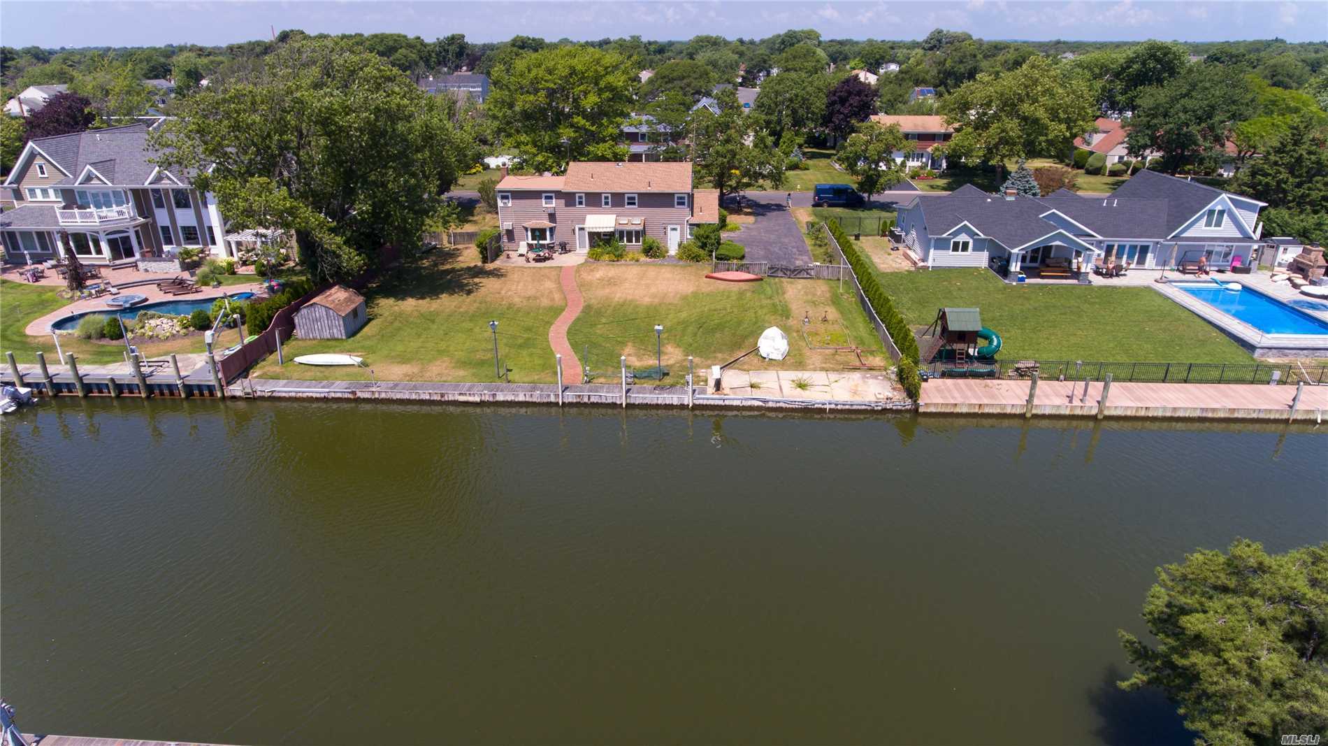 Location Location! Oak Neck Association. 125 Ft. Of Bulkheading, 5 Bedrooms, 2.5 Baths, Eik, Den W/ Fireplace, Fdr, Lr, 2 Car Garage. Renovate Your Dream Home