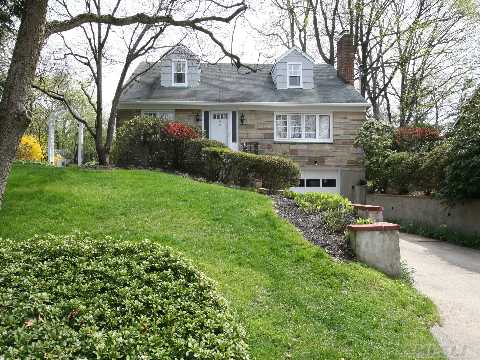 This Lovely Colonial/Cape Was Custom Built And Sits At The End Of A Dead End Street In Baxter Estates. Lr/Fpl, Fdr, New Eik W/Skylight, Family Room Or Bedroom, 3 Additional Bedrooms, 2.5 Remodeled Baths. Full Basement. Absolutely Gorgeous Shy 1/3 Acre With Specimen Planting And Perennial Gardens.