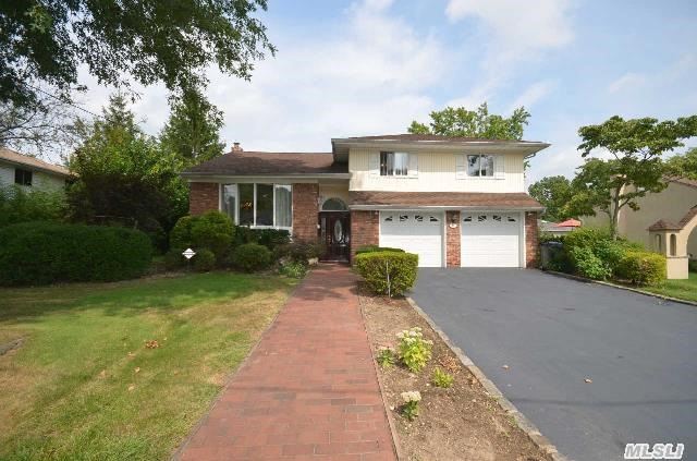 Spacious Split In Prime Searingtown Location - Midblock On Lovely Street,  Herricks Schools/Roslyn Post Office. New Roof,  New Siding,  New Appliances,  Granite Countertops,  Updated Baths,  Central Air,  2-Car Garage,  Igs,  Security System,  Hardwood Floors,  Gas Heating/Cooking. Nice Backyard With Patio And Deck.