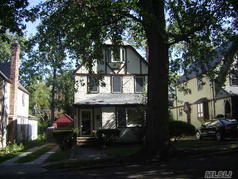 Totally Renovated Tudor, Hard Wood Floors Throughout, Large Landscaped Backyard, New Heating Unit, Windows & Doors.