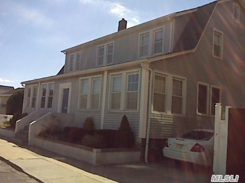 West End Beachside Colonial On Double Lot. Big Kitchen With Dining Area & Sliding Doors That Open To Warp-Around Deck That Leads To Back Patio. 3-Car Driveway.