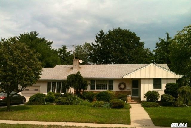 Charming North Syosset Home In The Flower Section. Mid-Block. Excellent Schools,  Walk To Lirr,  New Roof/Windows/Driveway&Walks. Landscaped. Hw Floors,  Wood Kitchen Cabinets,  Ss Appliances,  Stone Fireplace. 80X130 Property With Plenty Of Room To Expand!!Star Rebate $1, 336.40.