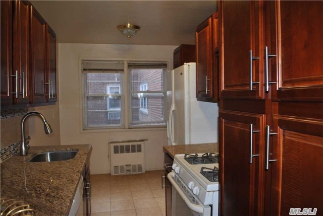 Renovated 1 Br In Elevator Building. Granite Countertops And All New Appliances And All New Bathroom W/Ceramic Flrs. & All New Fixtures. Hdwd Floors.  Pking Maybe Avail. Near Ielpi Park (Grace Ave), Lirr, Shopping, Restaurants, Movies Etc. Turn The Key, Move In And Go To Work The Very Next Day.