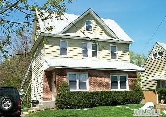 Two Family Duplex Located On Quiet Street. Oversized Property. Each Side Has 2 Br's/1 Bath,  Lr And Eik. Enclosed Porch. Huge Walk Up Attic. Basement. Updatd Gas Heat. 'As Is' Condition.