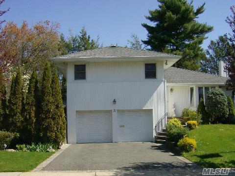 Ideal Location! Welcome To This Meticulously Maintained Home. Eat-In Kitchen With Granite Counter Top, Hardwood Flooring Throughout, Den W/Fplc & .5 Bath, Andersen Windows, Alarm,Brand New Cast Iron Boiler W/Lifetime Warranty. Fin. Basement W/Wet Bar. Paradise Private Property W/Heated Pool & Gazebo. Jericho Schools.