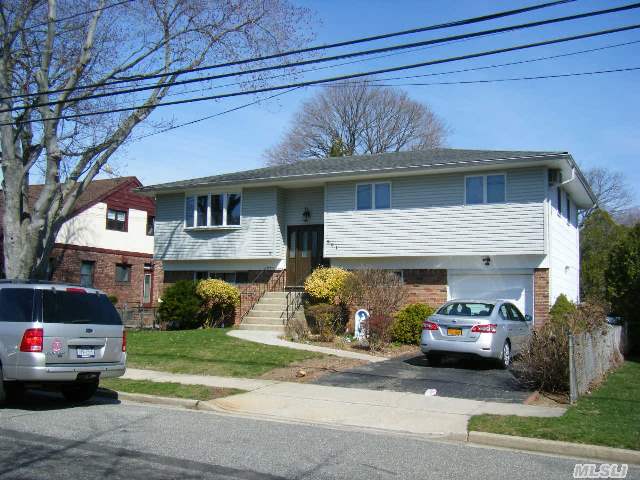 Large Rooms And Property. Great Massapequa School District. Taxes Are Without Star Program.. New Roof,  New Gas Heating System One Of Few Hi Ranches With Full Basement.