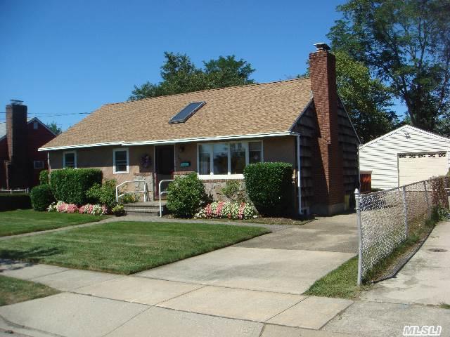 Great Ranch House In North Hicksville. New Roof,  Windows,  Updated Bath And Kitchen,  Cac,  Natural Gas Line In House,  Hardwood Floors,  Skylight,  Fireplace,  Brick Walkway,  Sliding Glass Doors To Rear Deck,  Private Rear Yard,  Mid-Block,  Two Car Detached Garage.