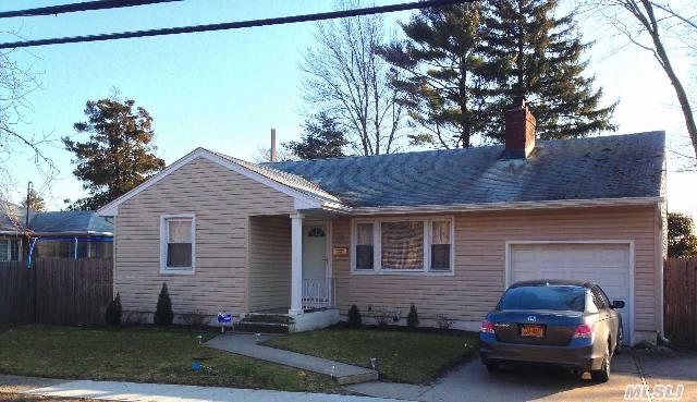 Recently Renovated Living Room With Wood Fireplace And A Full Finished Basement.  2 New Bathrooms,  Large Fenced Yard And Attached Garage.