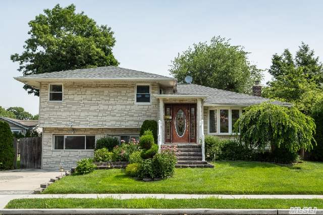 Beautiful Expanded Customized Home With Jericho Schools. Newly Renovated. High Ceilings  New Kit Including Appliances/Granite Floor  New Bthrms, Windows Energy Star Burner.  Roof 7 Years Old Trex Deck 6 Yrs Old Cac 3 Yrs Old.  Surveillance Cameras.  Room On Side To Add Garage.  No Money Spared!!! Must See!!!