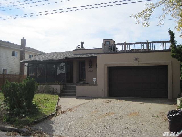 Charming Ranch In Beautiful Bay Colony With Spectacular Views.  Living Room/Dining Room With Vaulted Ceiling And Fireplace,  Large Eik W/ Vaulted Ceiling,  2 Large Bedroom,  1 1/2 Baths,  Wood Floors Through Out,  Heated Sun Room With Bay Views,  Rooftop Deck With Amazing Bay Views.  New Stucco On Exterior And New Gas Boiler.