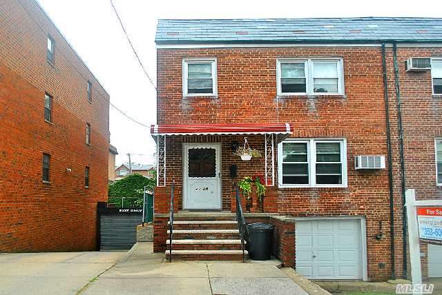 Brick Two Family 5/4 Over Full Basement With Great Potential,  Garage & Yard,  New Boiler,  New Awning,  Young Roof,  Great Home & Investment. School District 26 P.S. 173 & J.H.S. 216.