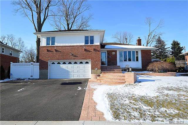 Mid Block Spectacular Updated Brick Split. Beautiful Eik W/Stainless Steel Appliances & Breakfast Area, Lg Lr W/Bay Window, Oversight Formal Dr, Redone Bath W/Designer Delight Tiles, Jacuzi & Silestone , Updates: Cac, Heating W/ Smart System, Doors, Brick Walkway & Newly Fin Bsmt, Pella Windows, 200 Amp Hardwood Floors, Hi Hats, Brick Patio.(Taxes Are Being Grieved By 23%.