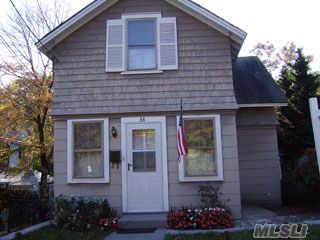 Beautiful Colonial In Village Of Roslyn. Roslyn Schools. Mid-Block, Wood Floors, Walk Out Basement, Large Private Yard. First Floor Features A Living Room, Dining Room, Eat-In-Kitchen, And A Half-A-Bath. Second Floor Features Bedroom, Master Bedroom, And A Full Bath. Near All. Better Than A Condo At This Price!