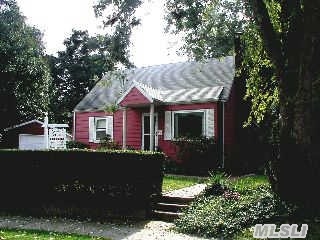 4 Bedrooms,  Living Room,  Sitting Room With Fireplace With Sliding Glass Doors To The Wood Deck.... 2 Full Baths... Needs Tlc....