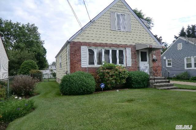 Welcome Home! Lovely Home With Mid Block Location Is Waiting For You To Call It Home. Large Living Room,  Formal Dining Room,  Eat In Kitchen,  Four Bedrooms,  Office/Sitting Area,  Full Basement With Ose,  Newer Burner,  Covered Patio Area And Yard. Don't Miss The Opportunity To Make This House Your New Home.