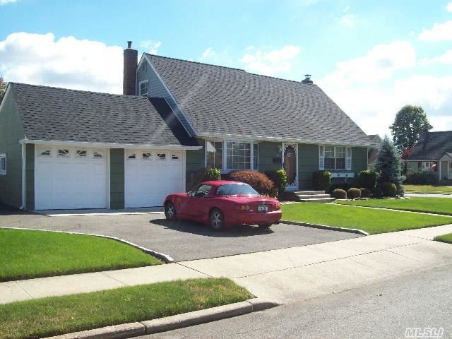 New To The Market,  4 Bedroom Cape With 2 Car Garage On An 80' X 100' Corner Property.