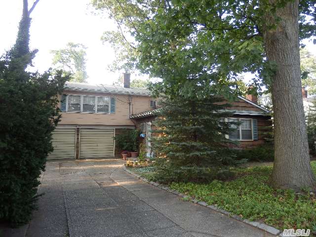 Expanded Split Level Home Just Steps From Manhasset Bay Situated On A 70 X 100 Lot. Living Room W/Fpl. Dr,  Kitchen,  3/4 Bedrooms,  1.5 Baths. Attached 2 Car Garage With Huge Bonus Room Or Fabulous Mbr. Finished Lower Level. Tlc Required But The End Result Will Be Fabulous !