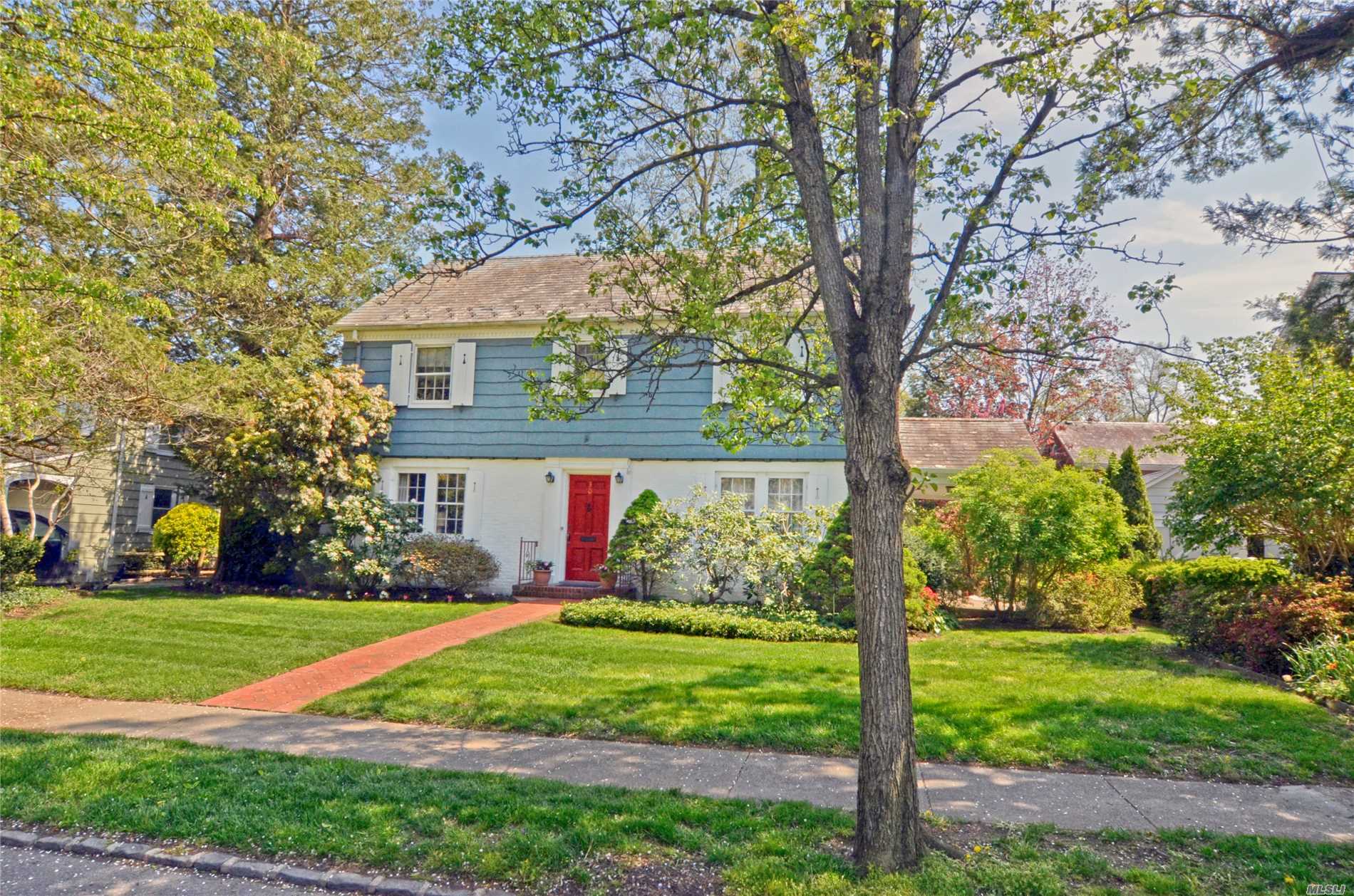 A true Classic! Beautiful center hall colonial offering the handsome detailing of yesteryear not often found today. Spacious principle rooms. Mature plantings surrounding a lovely brick patio and covered side porch. Beach and mooring rights on Manhasset Bay with paid Association dues. Convenient distance to highly coveted PW LIRR station and town.