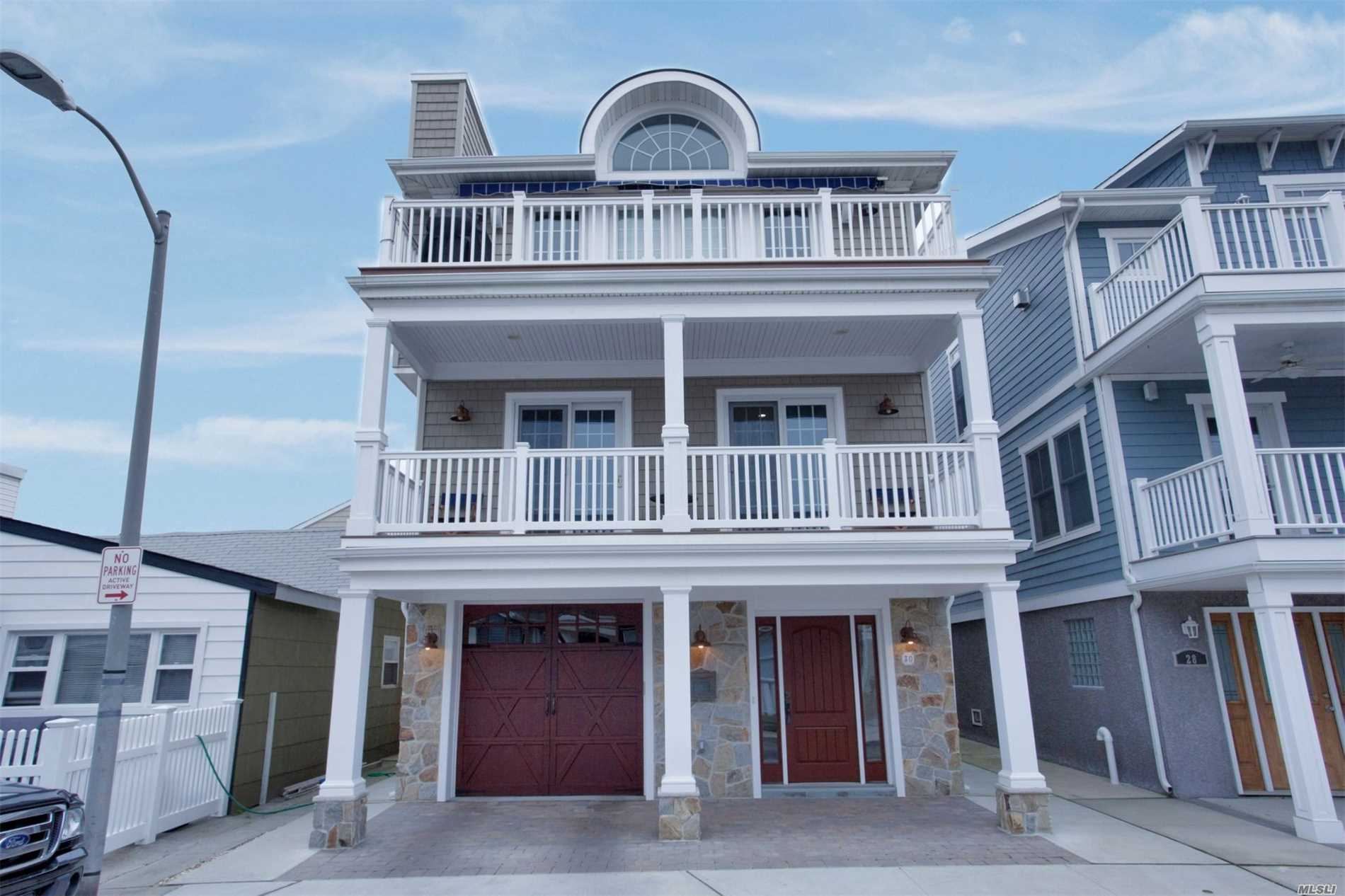 Impeccably Designed Beachside 2016 Fema Compliant Contemporary: Features: Grand Open Layout, Living Rm W/Wood Burning Fireplace, Chef&rsquo;s Kitchen W/Granite Island/Counters & Custom Cabinets, Powder Rm, Master Ensuite, 3 Additional Bdrs & 2 Full Baths, Gorgeous Hw Flooring, Crown Molding, Cac, 2 West Facing Decks, Parking For 4 Cars, Bose Surround System & Outdoor Shower. No Expense Spared! See Attached Fact Sheet For All High End Finishes. A Home Inspector&rsquo;s Dream!