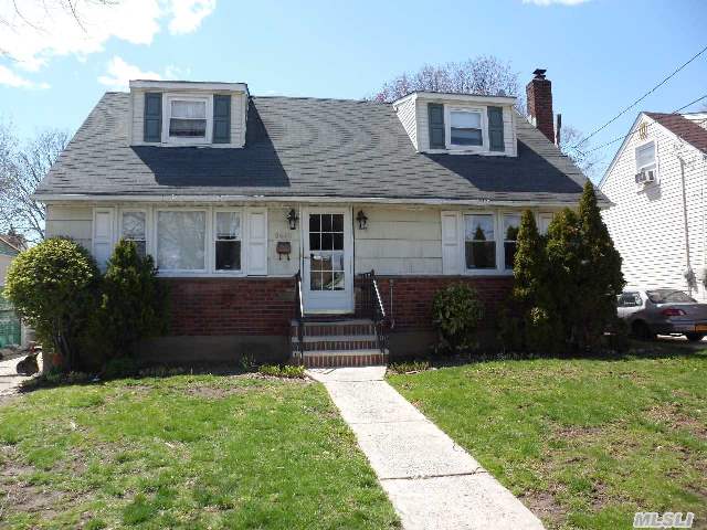 Charming 4 Bedroom,  2 Bath Cape In The Heart Of Bellerose Terrace. Close To Transportation And Shopping.