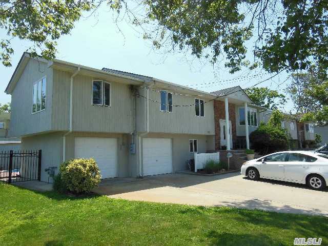 Mint Barnum Island Extra Wide- Line Hi Ranch On A Dead End Street . Hard Wood Floors Thru Out . Lg Lr Fdr And Eik That Has Cherry Wood Cabinets Granite Counter Tops And Ss Apps. Master Suite With Hugh Wic. Ground Floor Offers Hugh Tiled Family Room With Sliders Leading To Beautiful Yard. 2 Bdrm And .5 Bath And A 2 Car Garage. Close To School,  Park,  And Lirr