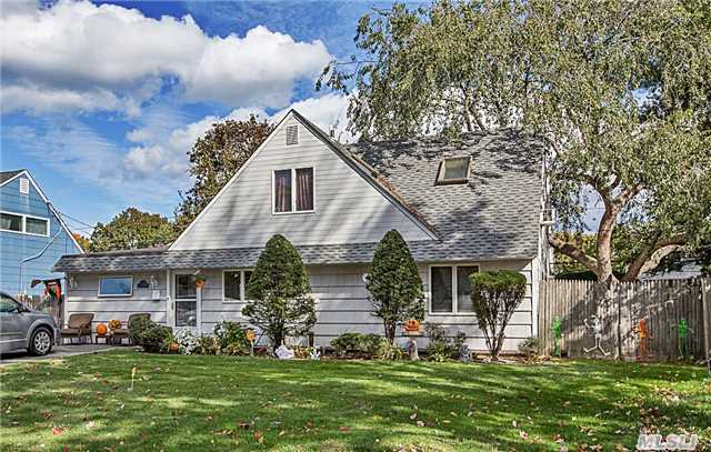 Expanded With Class! Chef's Custom Designed Kitchen W/Corian Counters, Laundry Area Off Kitchen W/Stackable Wash&Dryer, Dining W/Wood Floors, Formal Living, Extended Den Off Rear Of Home, Storage Garage In Front. Private Upstairs Has 2 Br. W/Skylites, Full Bath. Great Yard With Custom Walkways. Shed Can Stay Or Be Removed. Above Ground Oil Tank. All Additions Permitted!