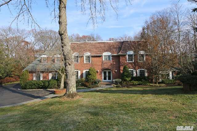 Majestic Center Hall Colonial. Gracious Spacious Rooms. Elegant Bridal Staircase,  Luxurious Master Suite With His And Hers Baths.  Set On Scenic Professionally  Landscaped One Acre. Syosset School District.