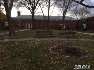 Set Back In A Courtyard Setting - Upper 2 Bedroom, Hardwood Floors, Dining Area, Livingroom W/ Play Area, Renovated Kitchen With Washer/Dryer/Dishwasher & Stainless Appliances, Renovated Bath, Pull Down Stairs For Attic Space, Plenty Of Storage & Closets, Close To Trans/Shops.