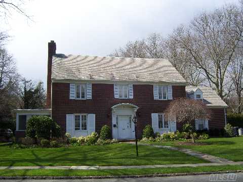 This Stately Renovated 4/5 Br, 3.5 Ba Brick C/H Colonial In The Village Of Russell Gardens Features A Lr / Fireplace, Formal Dining Room, Large Eat In Kitchen, Den, & Master Br W/Fireplace. There Are Wood Floors And Moldings Throughout.   The Huge Finished Attic Can Be A 5th Br Or 2nd Den.  The Finished Basement Has A Fireplace.  This Home Is Convenient To The Lirr & Town.