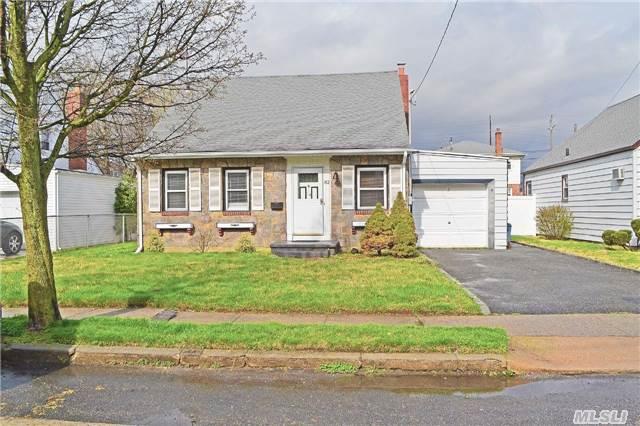 Well Maintained Cape, Near To Lirr. Large Backyard, Excellent Schools! Newly Painted, Eat In Kitchen With Hardwood Floors On First Floor. A Must See!