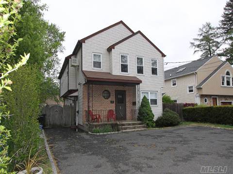 Spacious Two Family.  Front Entrance Leads Into A Mud Room.  As You Go Upstairs There Is A Cathedral Ceiling Living Room, Formal Dining Room And The Master Bedroom Has A Master Bath And Walk In Closet.  Side Entrance Brings You Into First Floor Apartment Which Also Has A Huge Formal Dining Room And A Nice Living Room Area.  Plenty Of Room In Basement For Storage.