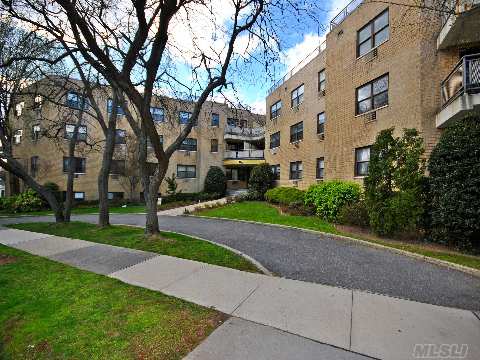 Welcome To The Plaza East. 1150+ Sq Ft. Corner Unit-Completely Renov- Oak Wood Floors, Custom Moldings, & Hi-Hat Lighting. The Spacious Galley Kitchen W/Granite Counter Tops And Lots Of Storage. Mstr Bth & 2nd Bth Are Elegantly Finished W/High-End Fixtures. Lots Of Closets, Sunny 20' Terr, Self Thermostat, Bb Heat Incl. 1 Garage Spot, Laundry On Flr. Lirr,Shopping,Parking.