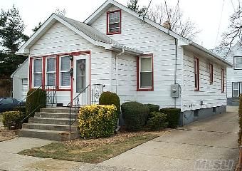 Super Starter On Oversized Parklike Property!  Quiet Street With Lots Of Room To Grow, 4 Car Detached Cinderblock Garage, Basement With Ose, Close To Town & Lirr-Purchaser Agrees To Be Preapproved Through Seller's Preferred Lender.