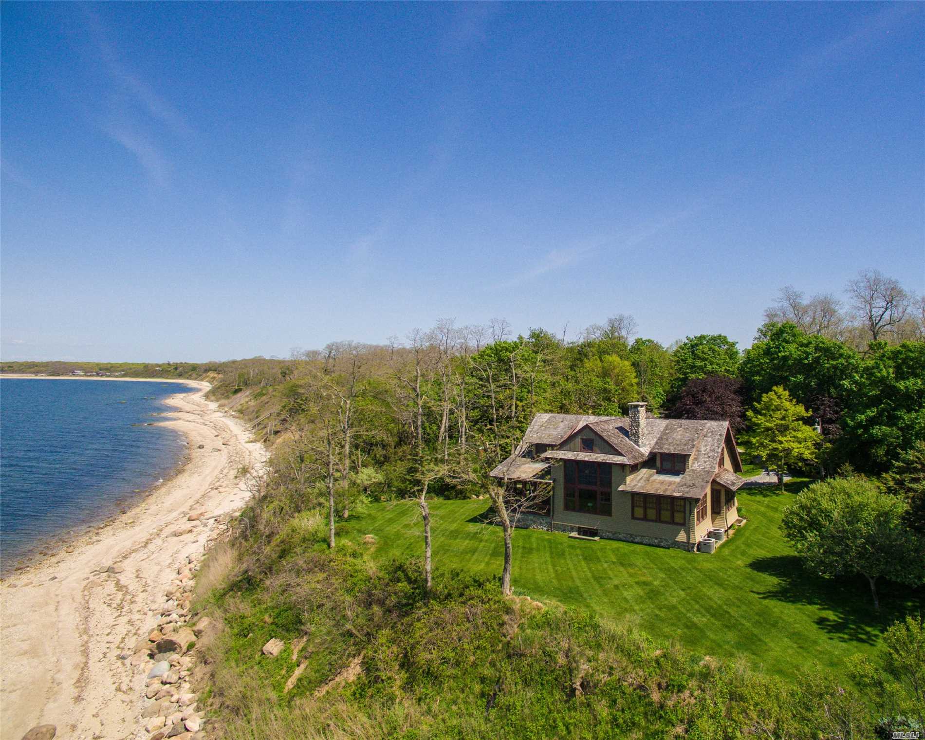 A 6600-Foot Drive Down A Narrow Lane Leads Through Woods And Vineyards To This Handsome Shingle-Style Home, Set On An Extraordinarily-Private 2.5-Acre Waterfront Estate With 340 Feet Of Low-Bluff Frontage On Long Island Sound. Completed In 2009, The Residence Is Amenity-Rich And Exquisitely Crafted. Come Home And Live Graciously.
