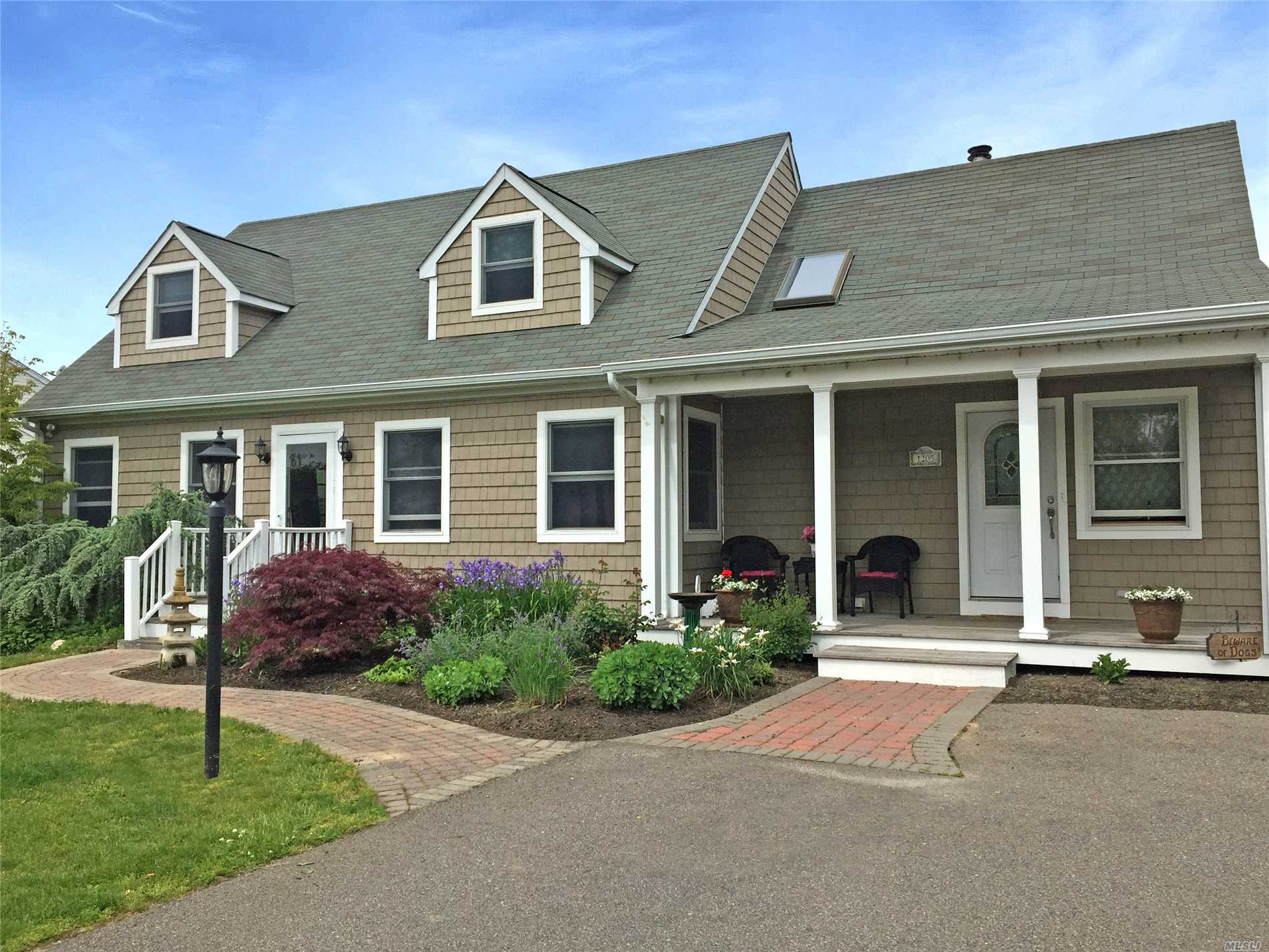 Delightful Cape In Southold,  With Good Bones Has Everything You Need To Make This A Fantastic Year Round Or Vacation Home.Located In A Quiet Neighborhood On A Cul-De-Sac With Southold Park District Beach Rights, This Home Has A Lovely Fenced In Backyard And, Large Deck With A Outdoor Kitchen With Gas Barbecue, Outdoor Stone Fireplace, And 20 X 40 Heated Salt Water Pool Make It Ideal For Entertaining, Plus A 3.5 Car Heated Garage With 2nd Story That Is Currently Used For Storage.