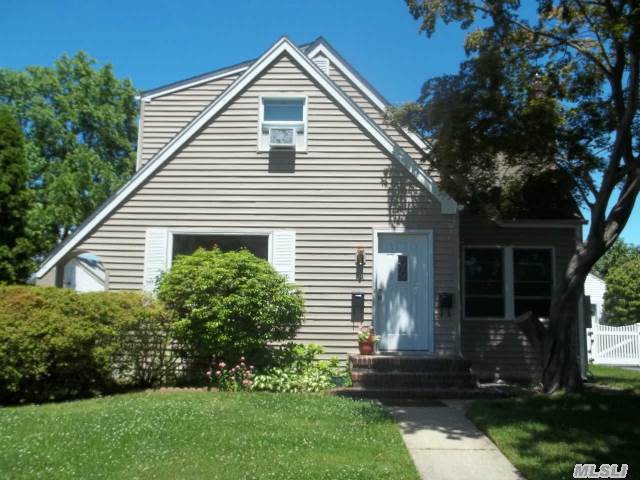 This House Is Placed On A Beautiful Tree Lined Quiet Street. Near Lirr,  Town,  And Shopping. Large Lot. New Vinyl Siding,  All New Anderson Windows,  2 Renovated Eiks,  Freshly Painted Interior And New Bath,  New Roof And Gutters.New Appliances, New Insulation, Gas Stove And Gas Dryer.