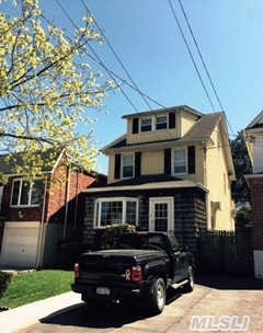 Beautiful Detached Colonial In Desirable North End Of College Point. Spacious Layout And Deceivingly Large Rooms. Living Room/Dining Room With Fireplace, Huge Eat In Kitchen, Attic With Two Large Rooms Can Be 4th And 5th Bedrooms, With Full Bath. Brand New Gas Heat. This House Is Zoned R3A, 2 Family Zone. One Block To Mcneil Park