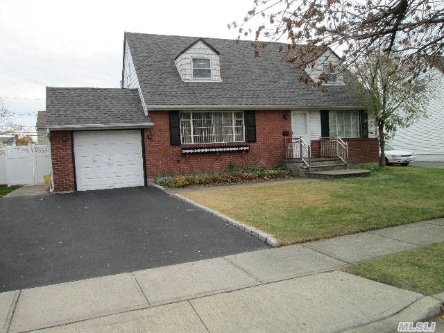 Welcome To This Very Special 4 Bedroom,  2 Bath Home Situated On A Quiet,  Tree-Lined Street. Mid-Block Location.Convenient To All, Shopping, Houses Of Worship, Transportation.Some New Amenities Include:New Full Bath, Hardwood Floors, New Heating System, New Brick Front Stoop, Bannister & Walkway.New Pvc Fence, New Roof + More. Priced Perfectly For Today's Market.Don't Miss!