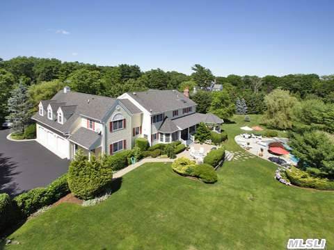 Syosset Oyster Bay Cove Vicinity. Private Road. 5215 Sq Ft Country Manor Estate Built In 2000 6 Bedrooms. Majestically Appointed. Rich In Architectural Details Set On 2 Scenic Acres Grand Staircase, Mahagony Leaded Glass Doors, Stone Fireplace, Gourmet Chef's Kitchen, Breakfast Area Leading To Wrap Around Porch, Gazebo, Gunite Inground Pool.