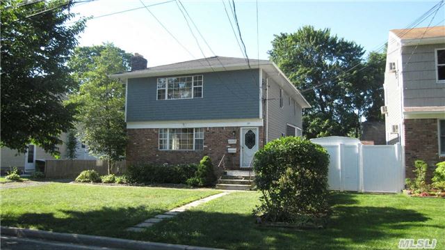 Rear Legal 2-Family. Two 3-Bedroom Apartments,  Whole House Well Maintained,  2 Updated Full Baths On First Floor.Fireplace,  Gas Heat. Detached  2 Car Garage. Fully Finished Basement.  Property Conveniently Located Walking To Lirr,  Shopping Center