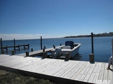 Amazing Bayfront Property On 40 X205 Property, This Home Being Sold Strictly As Is ...No Representation..Hurricane Sandy Damaged. Outstanding Southern Views* New Pier And Vinyl Navy Wall. Home Has New Roof And All New Windows.1 Car Det Gar Removed.   Investors This Is Your Opportunity! Raise The Home Or Knock It Down&Build The Home Of Your Dreams! Priced For Quick Sale!